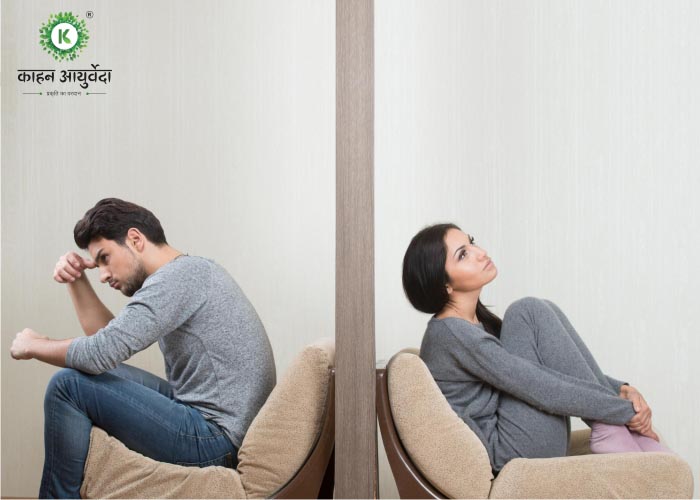 Sexual problems (ED) - upset man sitting on the Sofa Chair with woman on the back